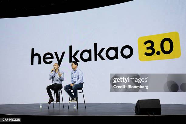 Joh Su-yong, co-chief executive officer of Kakao Corp., left, speaks as Yeo Min-soo, co-chief executive officer, listens during a news conference in...