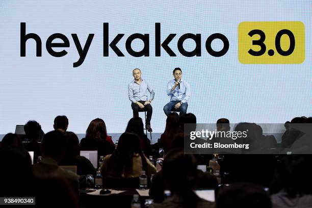 Yeo Min-soo, co-chief executive officer of Kakao Corp., right, speaks as Joh Su-yong, co-chief executive officer, listens during a news conference in...