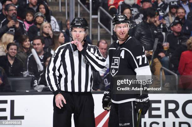Referee Brian Murphy and Jeff Carter of the Los Angeles Kings are seen during a game against the Calgary Flames at STAPLES Center on March 26, 2018...