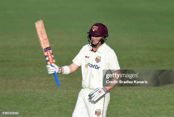 Matthew Renshaw of Queensland celebrates after scoring a half century of runs during day five of the Sheffield Shield final match between Queensland...