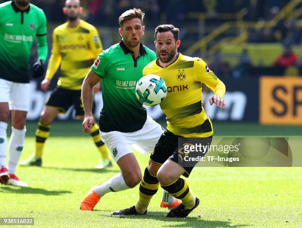 Niclas Fuellkrug of Hannover and Gonzalo Castro of Dortmund battle for the ball during the Bundesliga match between Borussia Dortmund and Hannover 96...