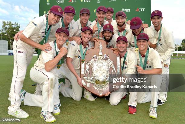 Queensland celebrate after winning the Sheffield Shield final during day five of the Sheffield Shield final match between Queensland and Tasmania at...