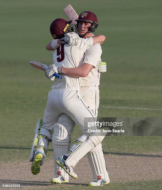 Matthew Renshaw of Queensland celebrates scoring the winning runs with team mate Marnus Labuschagne during day five of the Sheffield Shield final...