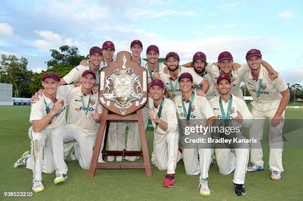 Queensland celebrate after winning the Sheffield Shield final during day five of the Sheffield Shield final match between Queensland and Tasmania at...