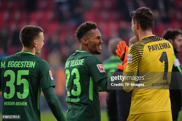 Maximilian Eggestein of Bremen, Theodor Gebre Selassie of Bremen and Goalkeeper Jiri Pavlenka of Bremen celebrate after winning the Bundesliga match...