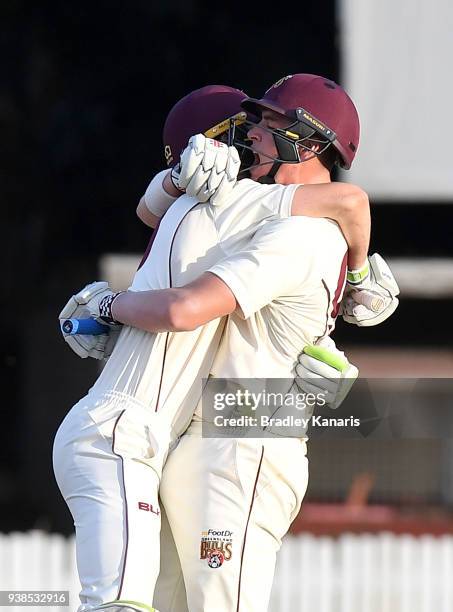 Matthew Renshaw and Marnus Labuschagne of Queensland celebrate victory during day five of the Sheffield Shield final match between Queensland and...