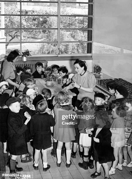 An undated picture, probably taken in the 1930s, shows little French kindergarten children listening to their teacher during their mid-afternoon...