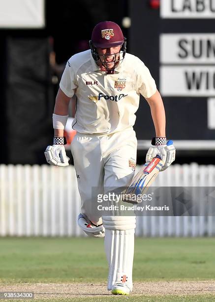 Matthew Renshaw of Queensland celebrates victory after hitting the winning runs during day five of the Sheffield Shield final match between...