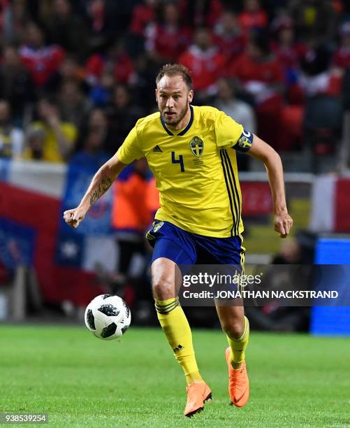 Sweden's defender and team captain Andreas Granqvist controls the ball during the international friendly football match between Sweden and Chile at...