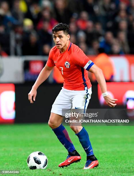 Chile's forward and team captain Alexis Sanchez controls the ball during the international friendly football match between Sweden and Chile at...