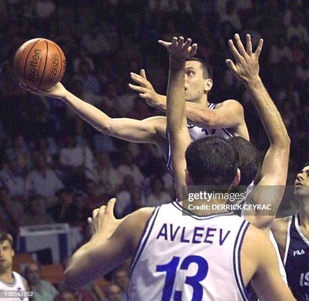 Russia's Zakhar Pashutin goes for the lay-up during the European Nations Championships match gainst Russia as Ruslan Avleev looks on in Pau 26 June...