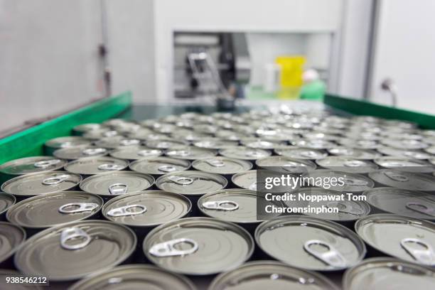 canned tuna on automatic conveyor belt, thailand - we can do it stock pictures, royalty-free photos & images