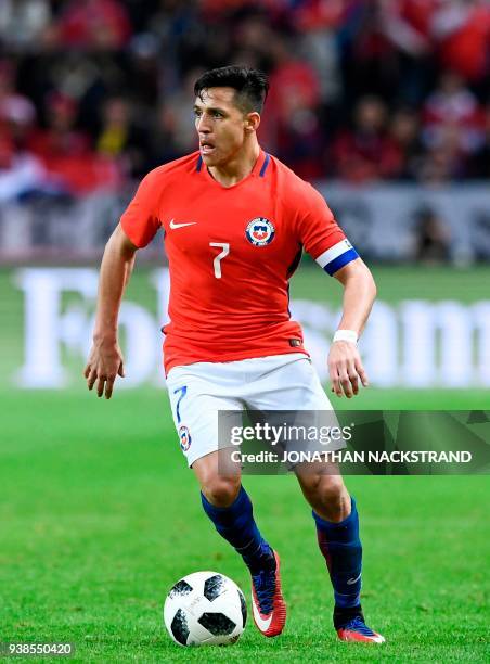 Chile's forward and team captain Alexis Sanchez controls the ball during the international friendly football match between Sweden and Chile at...