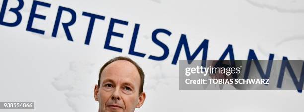 Thomas Rabe CEO of German media group Bertelsmann arrives for a group picture before the annual results conference of the company on March 27, 2018...