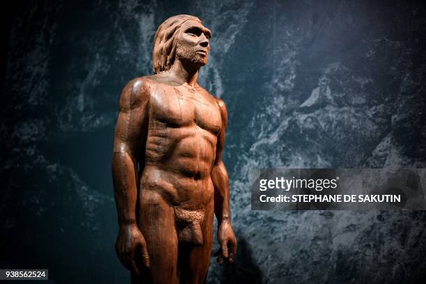 Picture taken on March 26, 2018 shows a reconstruction of the Man of Spy displayed for the Neanderthal exhibition at the Musee de l'Homme in Paris. /...