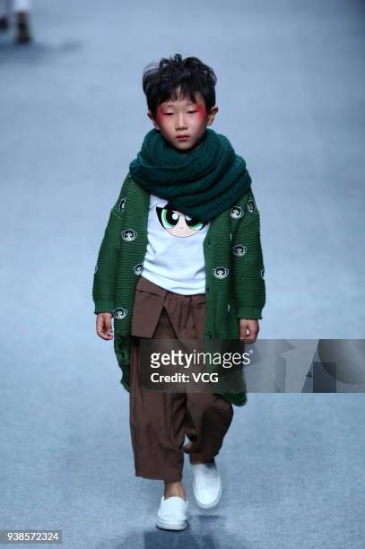 Model showcases designs on the runway at BEIBEI CHILD HOOD show by Designer Feng Sansan on day three of Mercedes-Benz China Fashion Week...