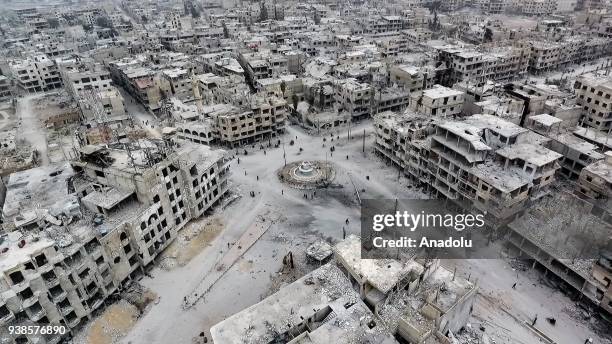 Footage captured by an unmanned aerial vehicle shows wreckages of structures of Arbin town, which has been under siege of Assad Regime, in Arbin town...