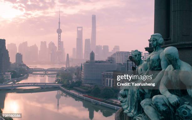 shanghai sunrise morning.ancient european sculpture culture and modern chinese building at lujiazui - the bund stock pictures, royalty-free photos & images