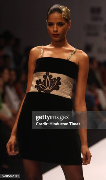Model showcases a creation by designer Raghavendra Rathore at Wills Lifestyle India Fashion Week, in New Delhi.