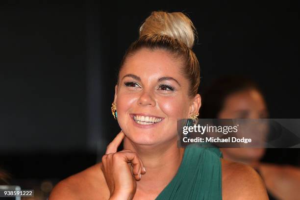 Katie Brennan looks on as Emma Kearney of the Bulldogs speaks after winning the AFLW Medal during the 2018 AFW Awards at The Peninsula on March 27,...