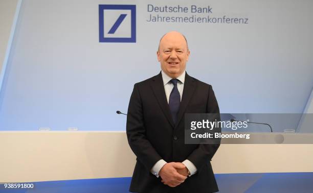 John Cryan, chief executive officer of Deutsche Bank AG, poses for a photograph as he arrives for a fourth quarter results news conference in...