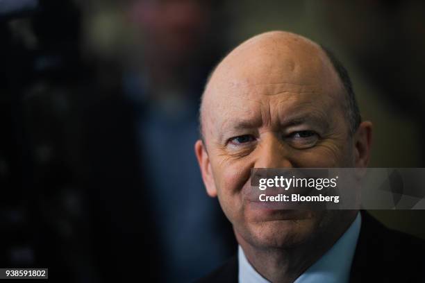 John Cryan, chief executive officer of Deutsche Bank AG, reacts during a Bloomberg Television interview as the bank announces fourth quarter results...