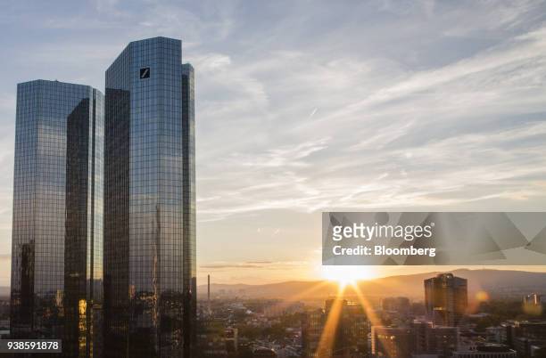The twin tower skyscraper headquarter offices of Deutsche Bank AG stand as the sunsets in Frankfurt, Germany, on Monday, July 25, 2016. Deutsche Bank...