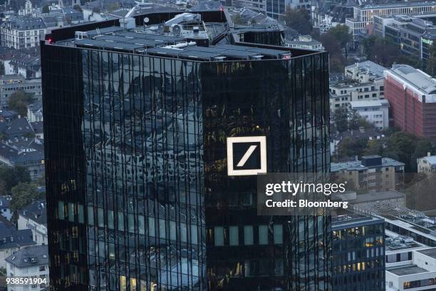 The Deutsche Bank AG logo sits on the bank's skyscraper headquarter offices in Frankfurt, Germany, on Monday, Oct. 13, 2015. Deutsche Bank AG is...