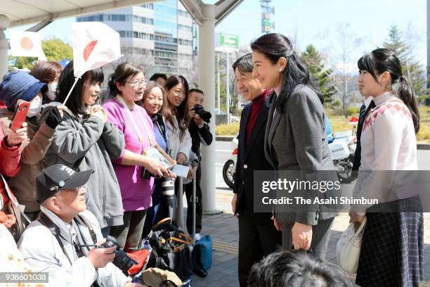 Crown Prince Naruhito, Crown Princess Masako and their daughter Princess Aiko talk to well-wishers on arrival at JR Nagano Station on March 26, 2018...