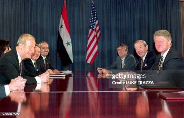 President Bill Clinton and Syrian President Hafez al-Assad open their talks to revive the Arab-Israeli peace process 16 January 1994 in Geneva,...