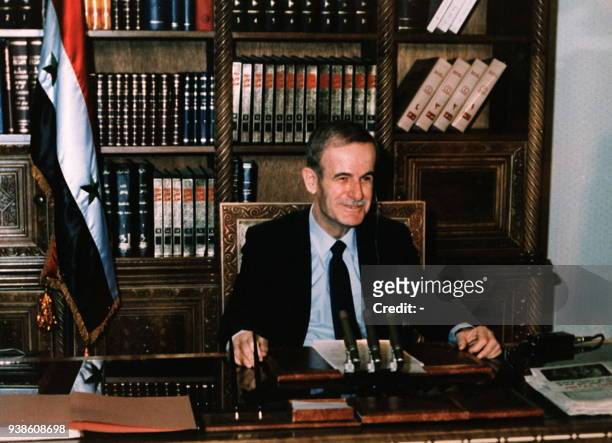 Photo from the 1980s shows late Syrian President Hafez al-Assad sitting at his desk in the presidential plaace in Damascus. Assad, who ruled Syria...