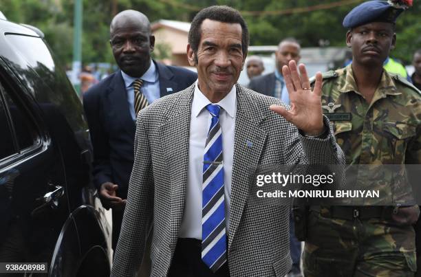 Botswana's President Seretse Ian Khama waves to the crowd as he leaves after a rally in his village Serowe on March 27 before officially stepping...