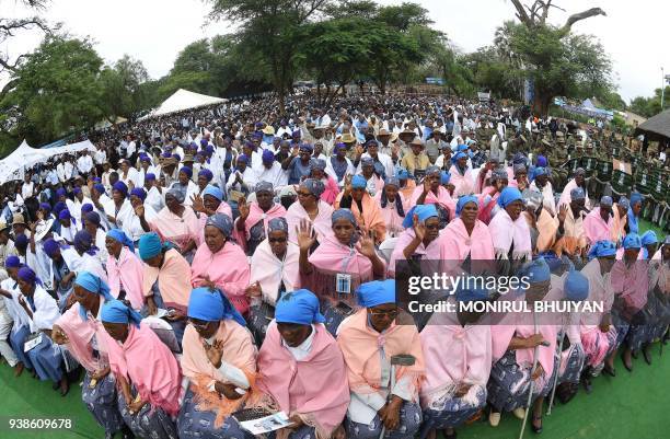 People from the village of Serowe cheer and dance as Botswana's President Seretse Ian Khama arrive at a rally in his village on March 27 before...