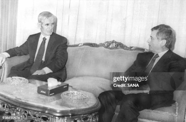 Syrian President Hafez Assad confers with his vice president Abed al-Halim Khaddam in Damascus 28 January. It is the first official apperance of...