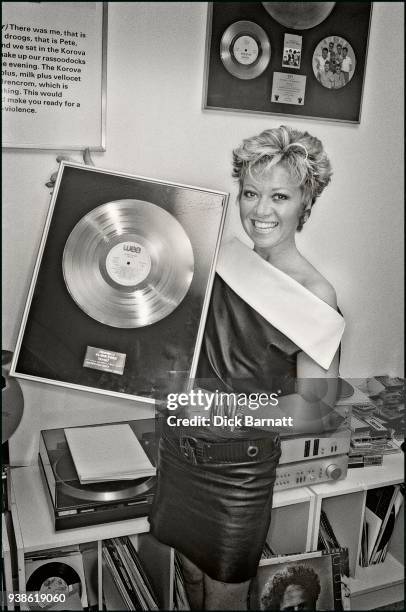Elaine Paige receives a gold disc for her album 'Stages', London, circa 1984.