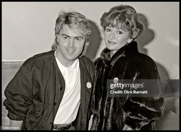 Mike Nolan of Bucks Fizz with actress Stephanie Beacham, circa 1985.