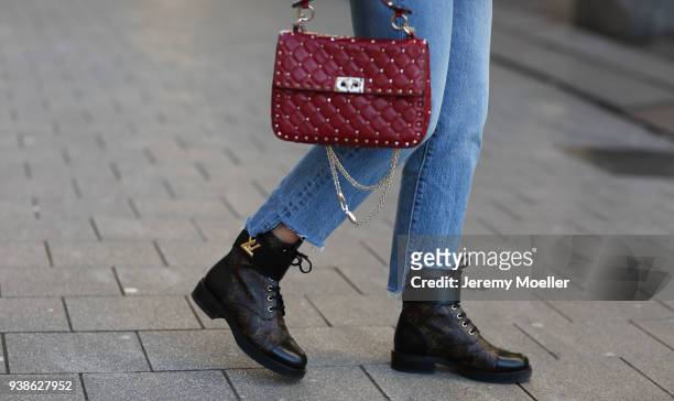 Sonja Paszkowiak from Shoppisticated wearing Valentino bag, Levis Jeans and Louis Vuitton boots on January 08, 2018 in Hamburg