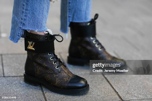 Sonja Paszkowiak from Shoppisticated wearing Valentino bag, Levis Jeans and Louis Vuitton boots on January 08, 2018 in Hamburg