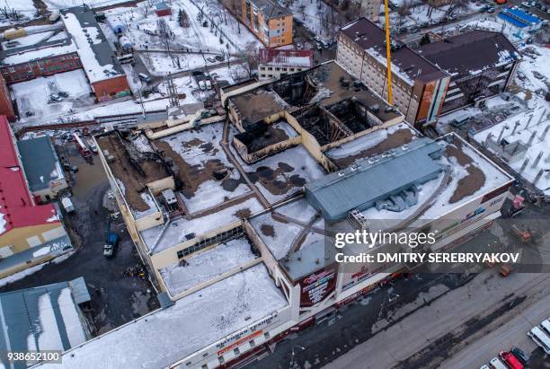 An aerial view taken on March 27, 2018 shows a multi-storey shopping mall after it was gutted by a fire in the industrial city of Kemerovo in western...