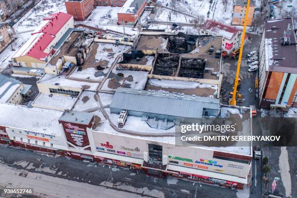 An aerial view taken on March 27, 2018 shows a multi-storey shopping mall after it was gutted by a fire in the industrial city of Kemerovo in western...