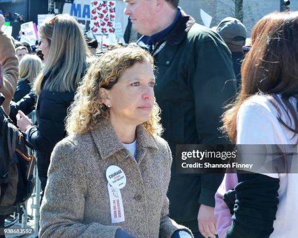 Florida Congresswoman Debbie Wasserman Schultz speaks to a woman attending the March for Our Lives Rally on March 24, 2018 in Washington, DC.