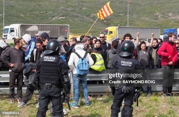 Spanish riot police evacuates Catalan separatists after breaking up a blockade on AP-7 motorway linking Spain to neighbouring France, near Figueras...