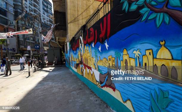 Picture taken on March 27, 2018 shows a side view of a mural painted on the wall of an Egyptian school in the Nile Delta City of Tanta, 120...
