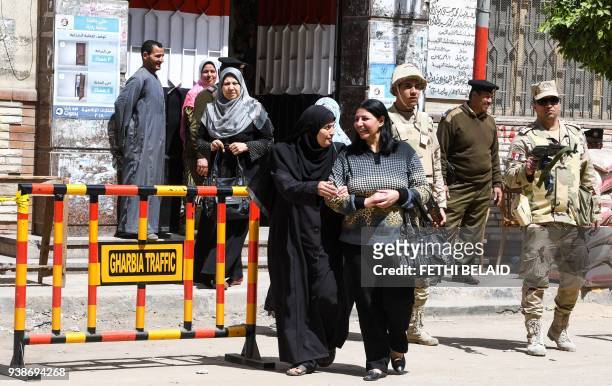 Egyptian women leave a polling station casting their votes at a polling station in the Nile Delta City of Tanta, 120 kilometres north of Cairo, on...