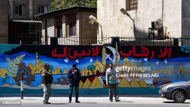 Picture taken on March 27, 2018 shows a view of a mural painted on the wall of an Egyptian school in the Nile Delta City of Tanta, 120 kilometres...