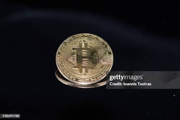close-up of bitcoin against black background - greek gold coins fotografías e imágenes de stock