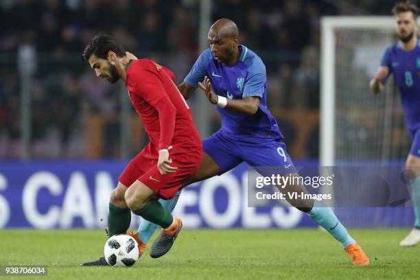 Andre Gomes of Portugal, Ryan Babel of Holland during the International friendly match match between Portugal and The Netherlands at Stade de Genève...