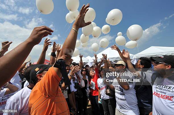 Members of the media release white ballons during the funeral of slain journalists in General Santos City, south Cotabato on December 4, 2009. Eight...