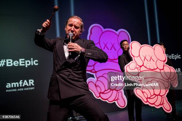 Auctioner Simon de Pury introduces an auction item during the amfAR Hong Kong annual event on March 26, 2018 in Hong Kong, Hong Kong.