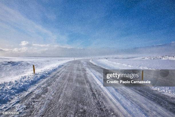 remote road during blizzard - hellnar stock pictures, royalty-free photos & images